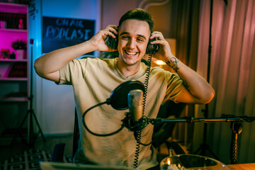man shooting or streaming video podcast or vlogg blogger at studio
