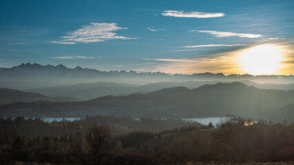 February evening. View from Czorsztyn to the Tatra Mountains against the background of the setting sun