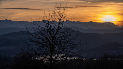 February evening. View from Czorsztyn to the Tatra Mountains against the background of the setting sun