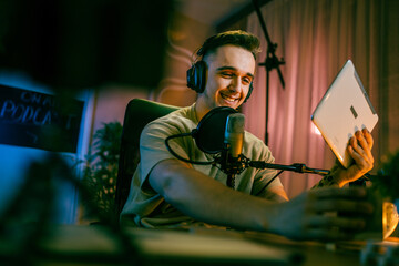 man shooting or streaming video podcast or vlogg blogger at studio