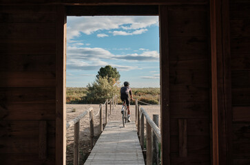 Into the wild: cyclist is ready to tackle any challenge on his gravel bike.
Following the cyclist.Cycling adventure.Elche, Alicante, Spain