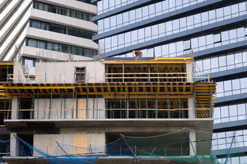 Workers make a strapping of rebar for pouring concrete.