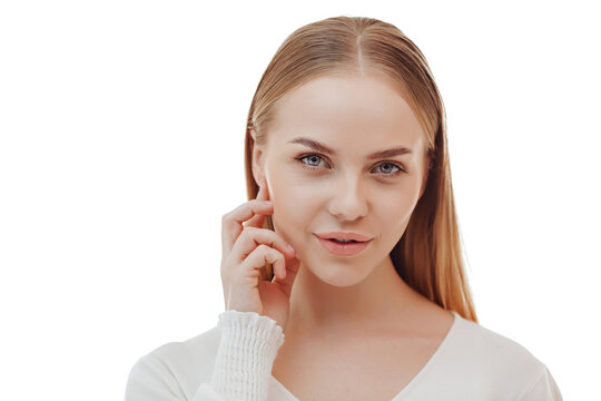 Beauty skin. Head and shoulders of blond woman model, touching glowing, hydrated facial skin, apply toner, skin cream or lotion for healthy look, after shower portrait, white background.