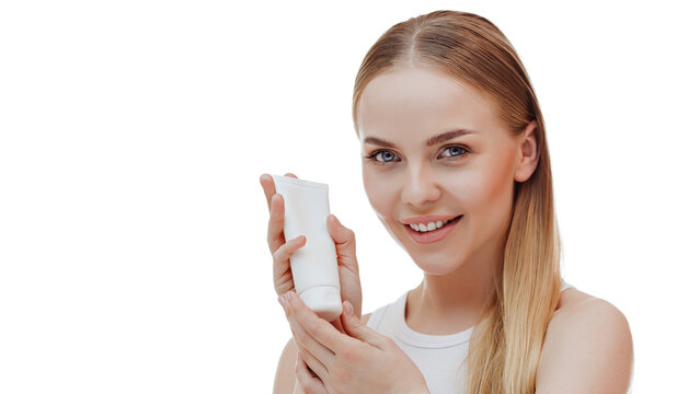 Portrait of a beautiful girl holding a bottle of shampoo conditioner in her hand.