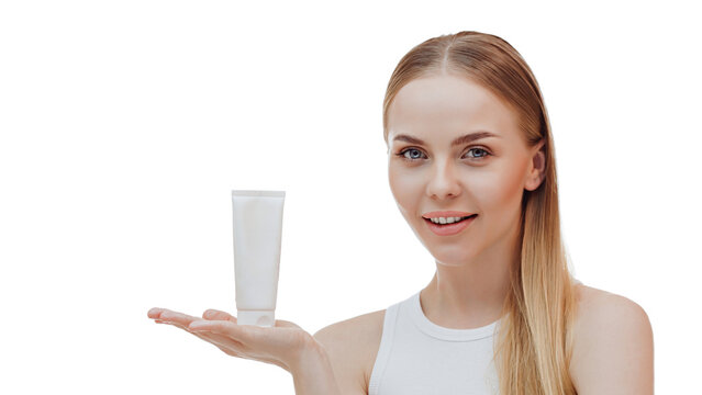 Beauty blonde holds a jar of shampoo or conditioner in her hands. Long blonde hair.