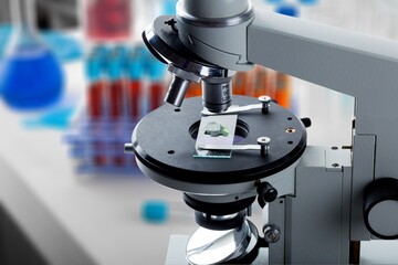 Modern microbiology microscope on table in laboratory,