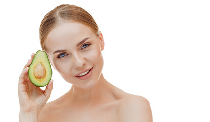 Smiling woman with half an avocado. Photo of attractive woman with perfect makeup on white background. Beauty and Skin care concept.