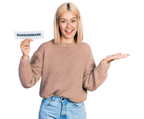 Beautiful young blonde woman holding ransomware banner celebrating achievement with happy smile and winner expression with raised hand