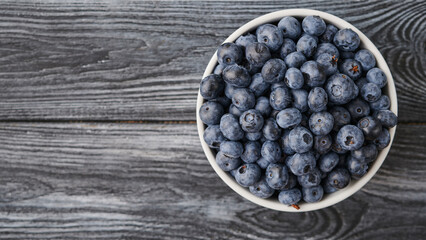 ripe blueberries on a wooden table