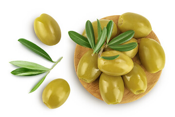 Green olives with leaves in wooden bowl isolated on a white background with full depth of field. Top view. Flat lay