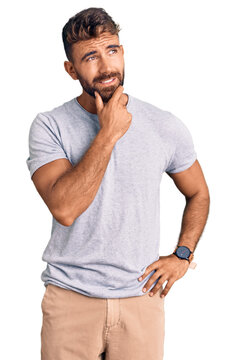 Young hispanic man wearing casual clothes thinking worried about a question, concerned and nervous with hand on chin