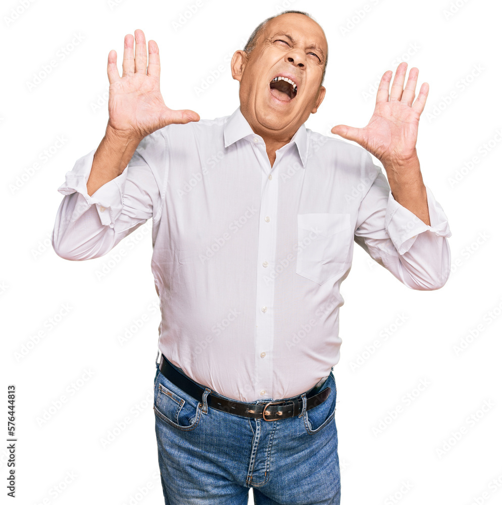 Canvas Prints Handsome senior man wearing elegant white shirt crazy and mad shouting and yelling with aggressive expression and arms raised. frustration concept.