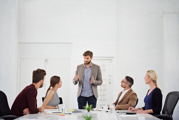 The creative juices are flowing. Shot of a group of businesspeople in the boardroom.