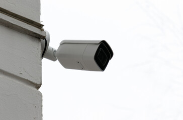 Surveillance camera mounted on the corner of the building.