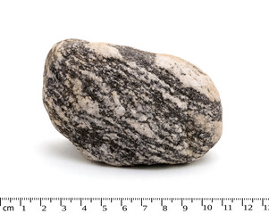 Gneiss metamorphic rock macro shot isolated on white background