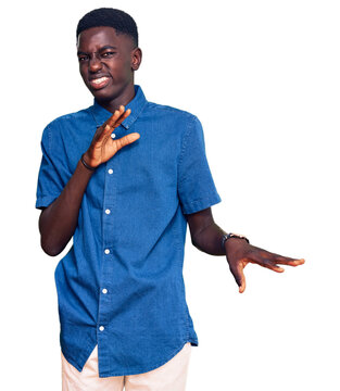 Young african american man wearing casual clothes disgusted expression, displeased and fearful doing disgust face because aversion reaction.