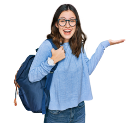 Young beautiful girl wearing student backpack celebrating victory with happy smile and winner expression with raised hands