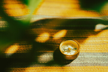 Vintage compass on striped fabric