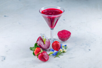 strawberry and beetroot in glass healthy fresh fruit and vegetable smoothies with assorted...