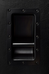 Close up of the handle of guitar speaker cabinet.
