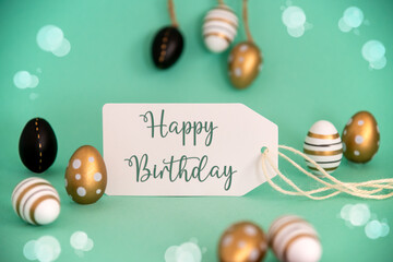 Fototapeta na wymiar Golden Easter Egg Decoration. Label With English Text Happy Birthday