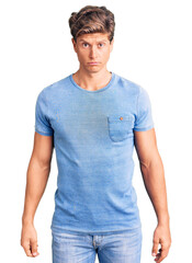 Obraz premium Young handsome man wearing casual clothes depressed and worry for distress, crying angry and afraid. sad expression.