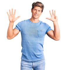 Young handsome man wearing casual clothes showing and pointing up with fingers number nine while smiling confident and happy.