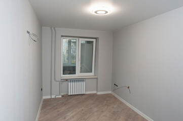 room after renovation, laminate and clean walls, restrained color of modern style and design
