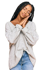 Beautiful hispanic woman wearing casual clothes sleeping tired dreaming and posing with hands together while smiling with closed eyes.