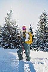 Mountaineer backcountry ski walking ski alpinist in the mountains. Ski touring in alpine landscape with snowy trees. Adventure winter sport. Kralova hola, Slovakia © Zedspider