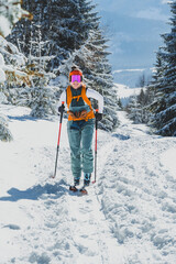 Mountaineer backcountry ski walking ski alpinist in the mountains. Ski touring in alpine landscape with snowy trees. Adventure winter sport. Kralova hola, Slovakia © Zedspider