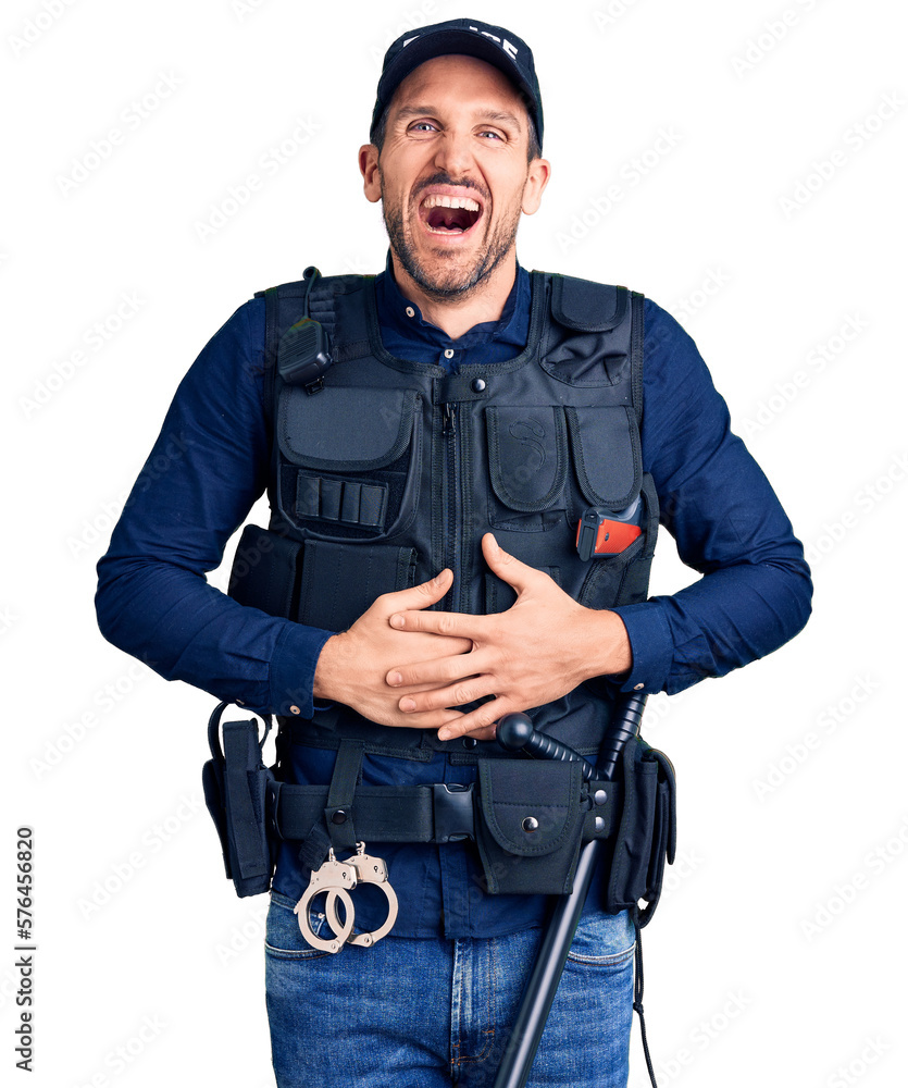 Canvas Prints young handsome man wearing police uniform smiling and laughing hard out loud because funny crazy jok