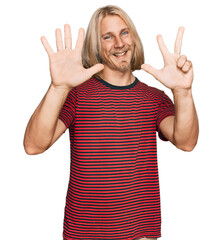 Caucasian man with blond long hair wearing casual striped t shirt showing and pointing up with fingers number eight while smiling confident and happy.