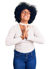 Young african american girl wearing casual clothes and glasses begging and praying with hands...