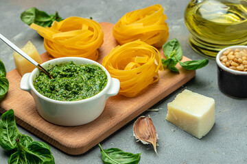 Italian raw Pasta tagliatelle with pesto. Restaurant menu, dieting, cookbook recipe top view