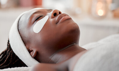Beauty, relax and eye mask with black woman in spa for skincare, facial treatment and wellness. Health, peace and luxury with girl and face patches product for cosmetics, dermatology and hospitality
