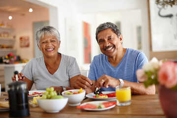 Getting a healthy start to the day. Shot of a happy senior couple enjoying a leisurely breakfast...