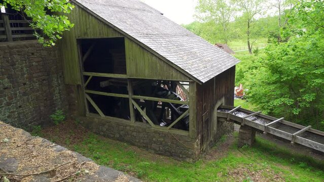 Water wheel and chase at Hopewell Furnace National Historic Site in Pennsylvania. American "iron plantation," with cold-blast iron blast furnace. Waterwheel supplied the power for air blast.