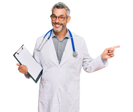 Middle age grey-haired man wearing doctor stethoscope holding clipboard smiling happy pointing with hand and finger to the side