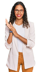 Young african american girl wearing business clothes clapping and applauding happy and joyful,...