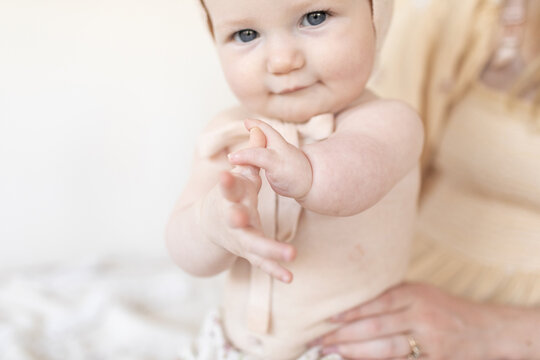 close up of baby hands with disability limb difference