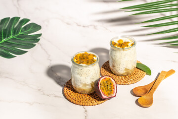 Yogurt with passionfruit in a glass. Vegan or gluten free diet. banner, menu, recipe place for text, top view