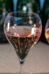 Tasting of rose brut Champagne sparkling wine in cellars of gran cru wine house in Epernay, wine tour in Champagne, France