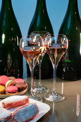 Tasting of rose brut Champagne sparkling wine in cellars of gran cru wine house in Epernay, wine tour in Champagne, France