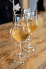 Tasting of cold brut Champagne sparkling wine in cellars of gran cru wine house in near Reims, wine tour in Champagne, France