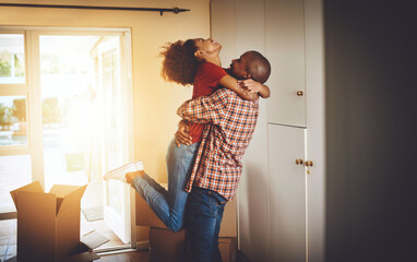 Its finally all ours. Cropped shot of a young couple celebrating their move into a new home.