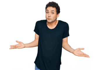 Young handsome man wearing casual black t shirt clueless and confused expression with arms and hands raised. doubt concept.