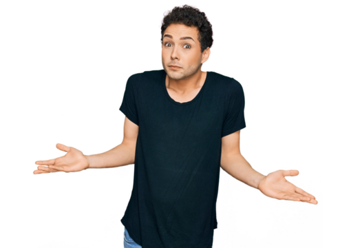 Young handsome man wearing casual black t shirt clueless and confused expression with arms and hands raised. doubt concept.
