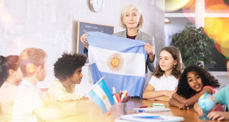 Fototapeta premium Kids learning together about argentina in geography class