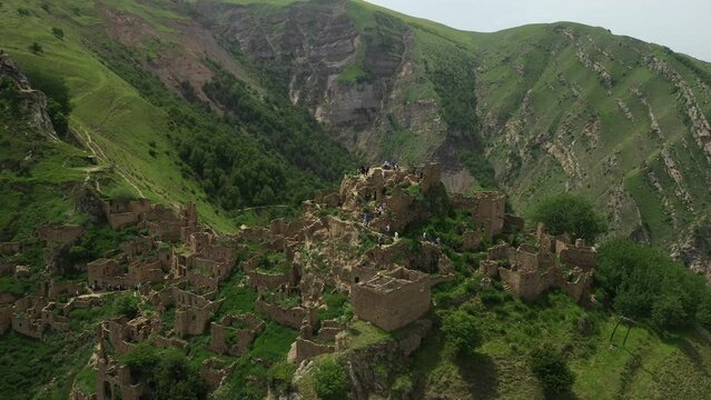 Aerial drone view of famous Gamsutl mountain village in Dagestan. Abandoned ruins of former village on a mountain top